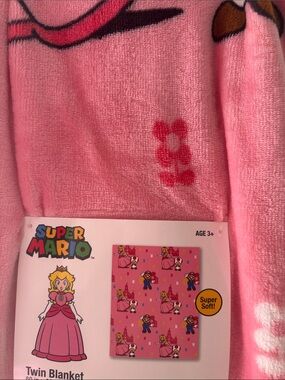 Nintendo Princess Peach Throw Blanket — Pink with Red and Yellow Accents